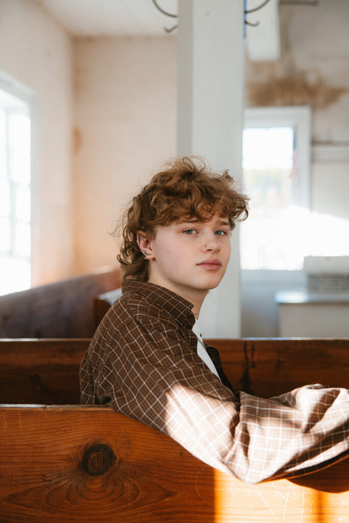 Senior Portrait on pew inside 1806 Old Log Church in Schellsburg, PA.